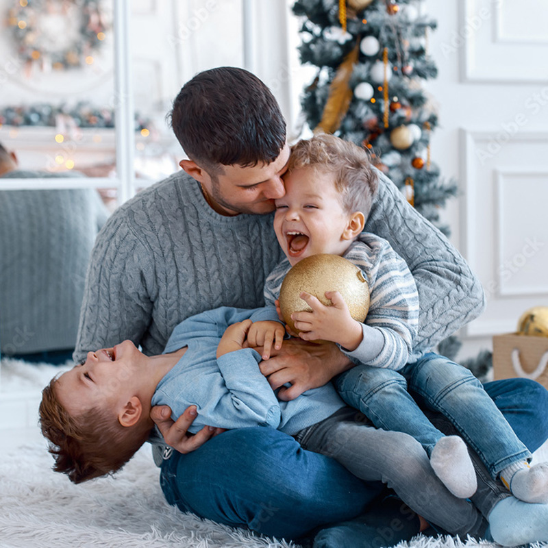 family smiling and playing